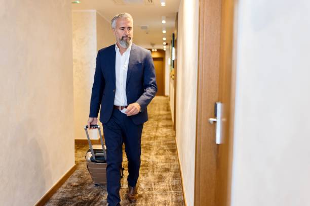 istock Businessman looking for his hotel room 1780138131
