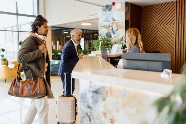 istock Hispanic businessman checking in at the hotel 1780138715