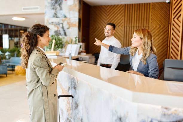 istock Woman talking with a receptionist at the hotel 1780139263