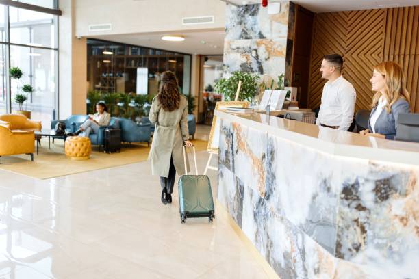 istock Male and female receptionist working at the front desk 1780139277