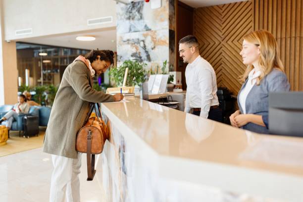 istock Hispanic businessman doing his check in at the reception desk 1780139283