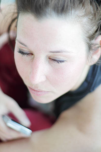 istock Female holding a mobile phone with eyes closed 178014287