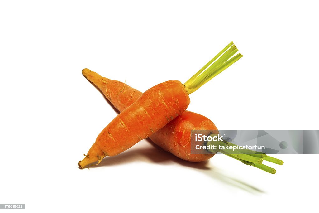 Baby carrots su sfondo bianco - Foto stock royalty-free di Arancione