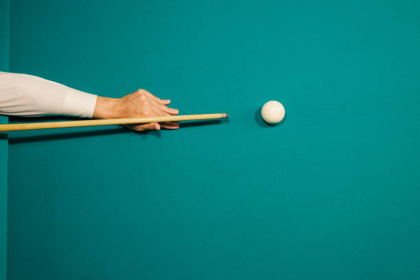 Billiard player at billard table or snooker american billiards pool sport game