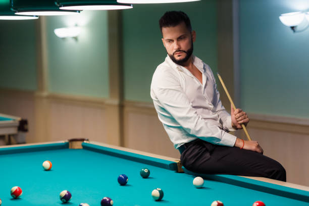 istock Billiard player at billard table or snooker american billiards pool sport game 1780154247