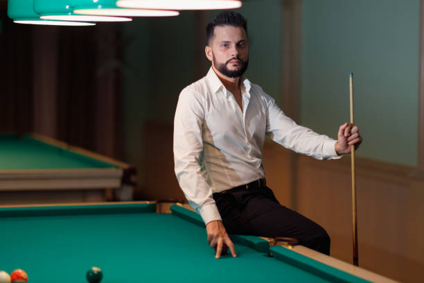 istock Billiard player at billard table or snooker american billiards pool sport game 1780154261