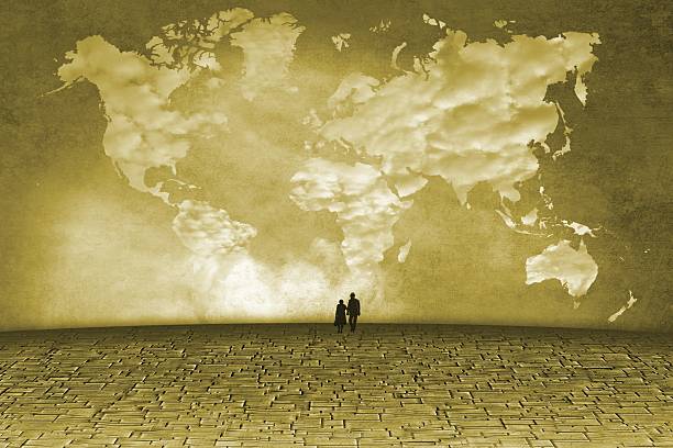 Surreal landscape with clouds in shape of world map and small figures of the elderly.