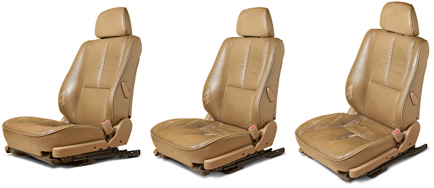 used worn leather car seats, beige color seats with wear and tear, including scuffs, creases and scratches, repair and services in leather upholstery restoration concept, isolated on white background