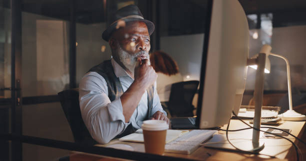 istock Computer, night and thinking with a business man in his office for late evening work on a deadline. Research, information or problem solving with a senior employee looking confused in the workplace 1780158512