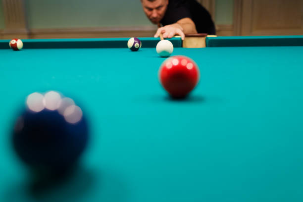 istock Billiard player at billard table or snooker american billiards pool sport game 1780163027