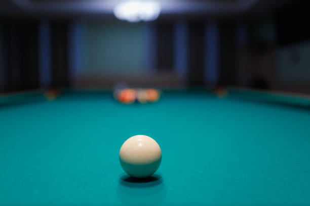 istock Billiard accessories balls and cue on a billiard table 1780163086