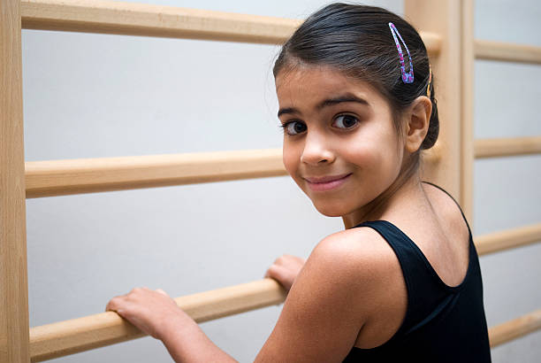 Smiling ballet student Portrait of smiling little girl in ballet class moroccan girl stock pictures, royalty-free photos & images