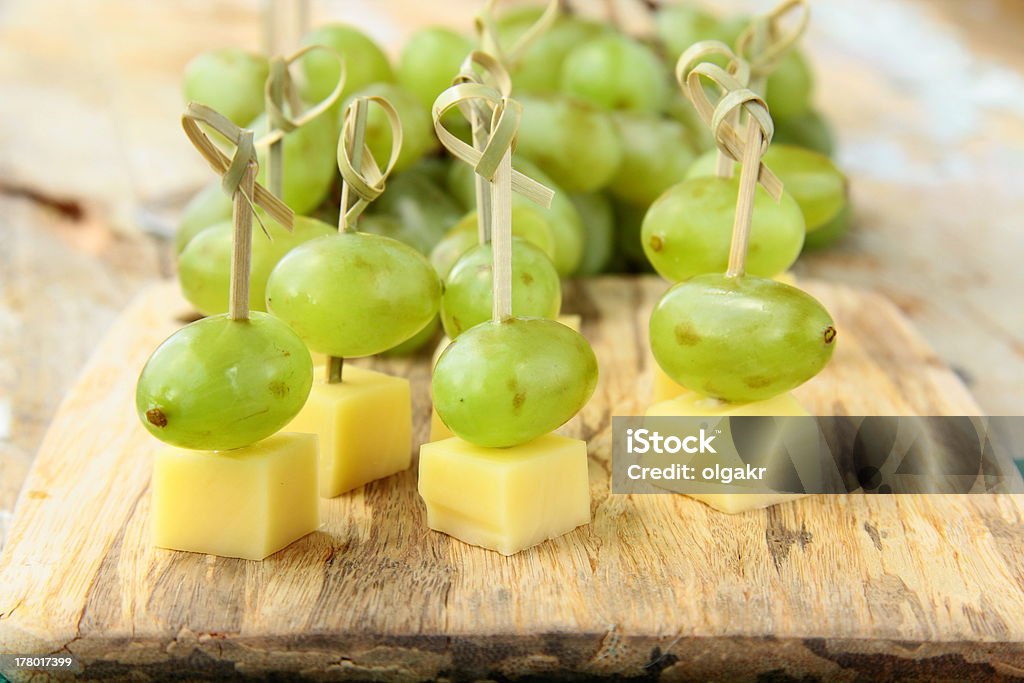 appetizer canape cheese with white grapes appetizer canape cheese with white grapes on bamboo skewers Canape Stock Photo