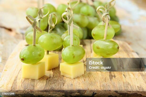 Appetizer Canape Cheese With White Grapes Stock Photo - Download Image Now - Canape, Cheese, Skewer