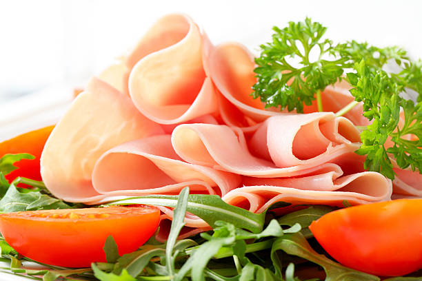 istock Sliced ham with arugula leaves and tomatoes 178017459