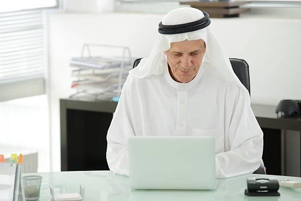 istock Portrait of a smart arabic business man using laptop 178019544