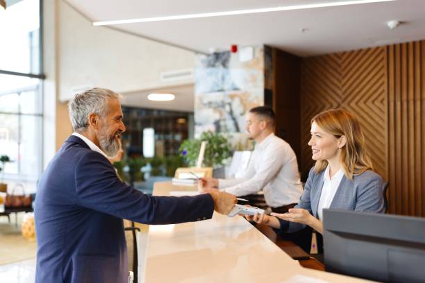 istock Elegantly dressed businessman checking out from the hotel 1780197522