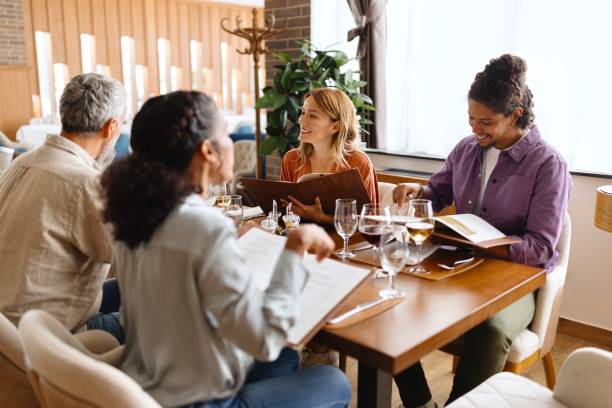 istock Smiling business people having a lunch break at the restaurant 1780198767