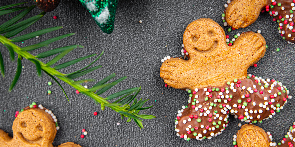 gingerbread man christmas cookie cinnamon, vanilla, ginger christmas sweet dessert holiday baking treat new year meal food snack on the table copy space food background