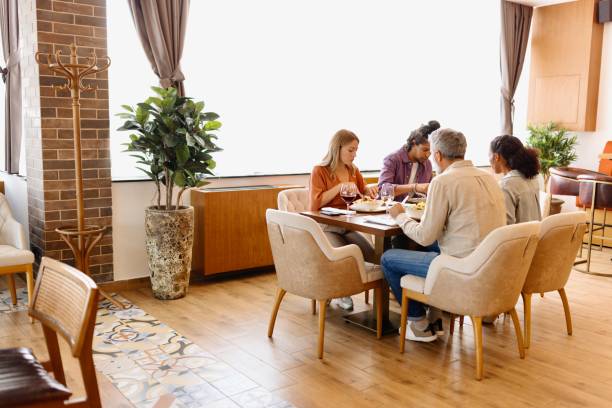 istock Modern people sitting at the hotel restaurant and having lunch 1780203735