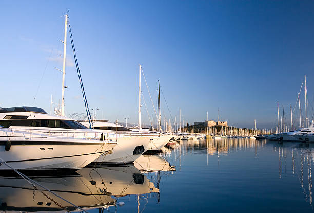 Yachts in Antibes with ancient fortress on background