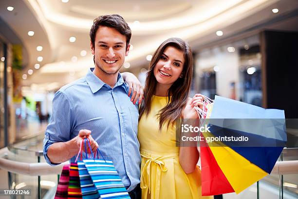 Portrait Of Happy Couple With Shopping Bags Stock Photo - Download Image Now - Couple - Relationship, Shopping, Retail