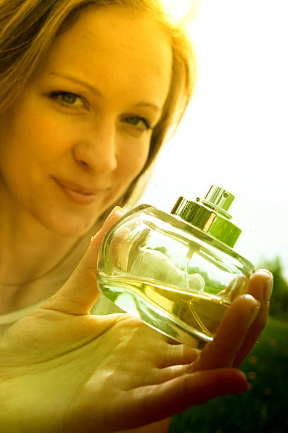 istock Woman with bottle of perfume 178022295