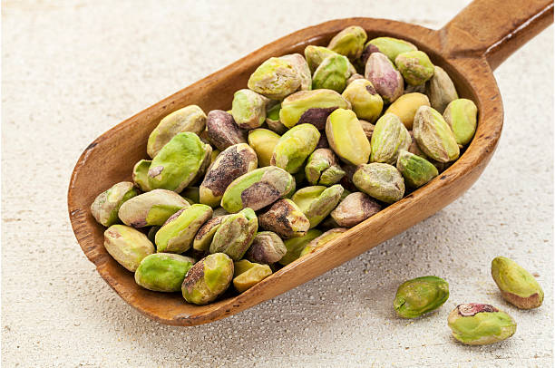istock raw pistachio nuts on a scoop 178022329