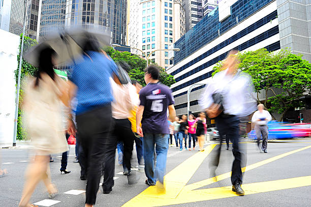 通りの交差点 - crosswalk crowd activity long exposure ストックフォトと画像