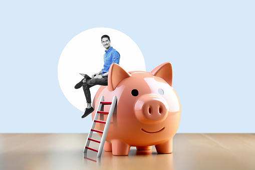 Businessman with laptop on a stack of sitting at a piggy bank in living room background. Success Concept. Art collage.