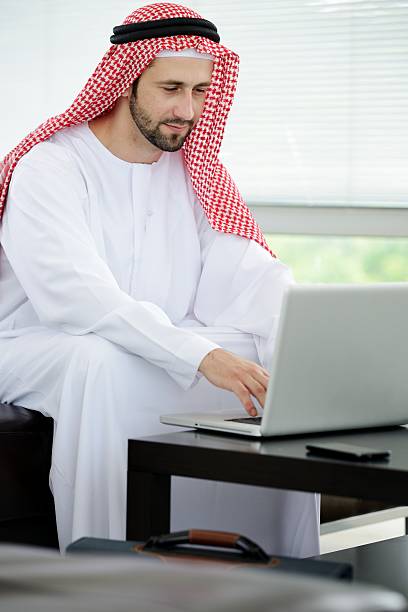 istock Portrait of a smart arabic business man using laptop 178022784