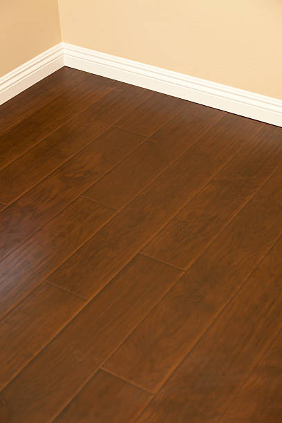 istock Newly Installed Brown Laminate Flooring and Baseboards in Home 178022885
