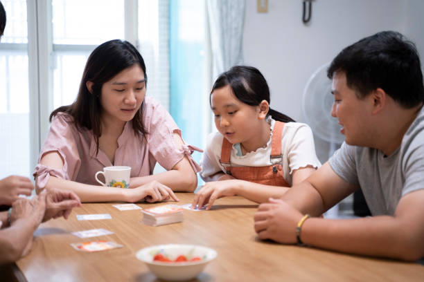 istock The three generations family board game time 1780234609