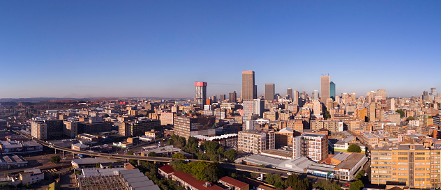 Johannesburg city with the prominent Transnet building in the Carlton Centre, and the M31 overpass highway leading to the M2 highway that surrounds the city.