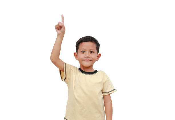 istock Asian little boy child pointing up isolated on white background. 1780234790