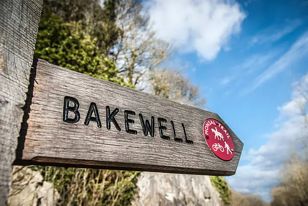Wooden footpath sign for Bakewell on the Monsal Trail, Derbyshire.