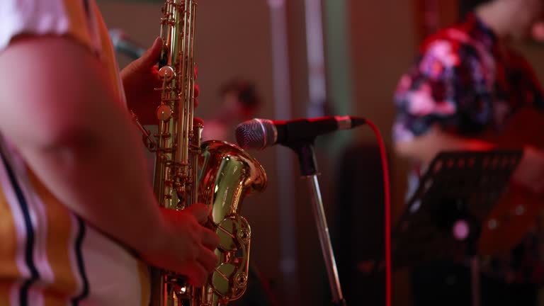 Soulful Serenade: Asian Saxophonist and Band Create Magical Musical Moments in Restaurant Performance