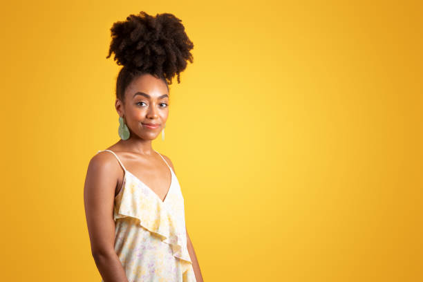 istock Positive pretty millennial black curly lady in dress enjoy weekend 1780242979