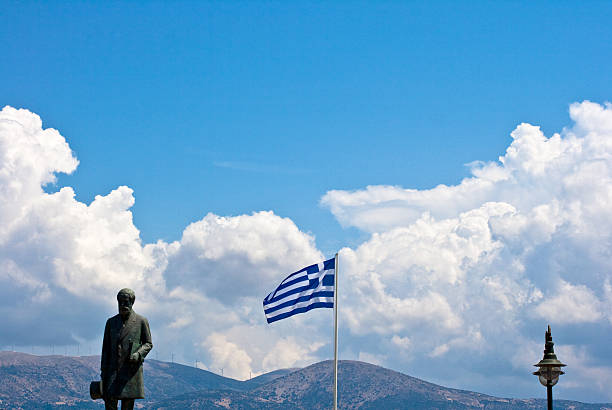 Greece flag and statue on a sky Greece flag and statue on a sky, Kefalonia - Greece lixouri stock pictures, royalty-free photos & images