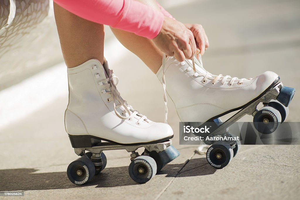 Close-up Of Legs With Roller Skating Shoe Close-up Of Legs Wearing Roller Skating Shoe, Outdoors Adult Stock Photo