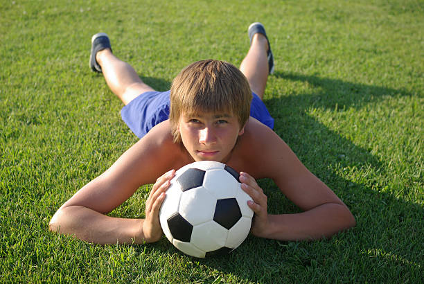 istock Boy with a soccer ball 178025680