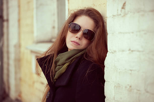 istock Pretty girl leaning on a wall 178026344