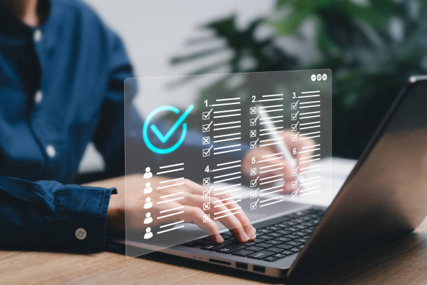 istock Checklist and clipboard task management verifying the validity and assessment form concept, Businesswomen use laptop to approve requests for document online evaluation test,Paperless online survey 1780264658