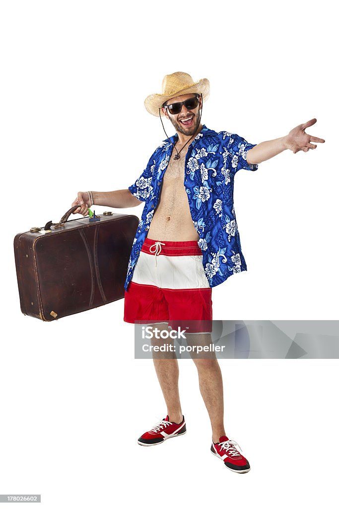 Confident tourist a young, attractive male in a colorful outfit ready to travel as a stereotype tourist Hawaiian Shirt Stock Photo