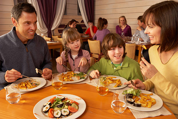 istock Family Eating Lunch Together In Restaurant 178027164