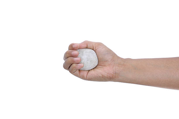 istock Female hand holding a stone isolated on white background 178028674