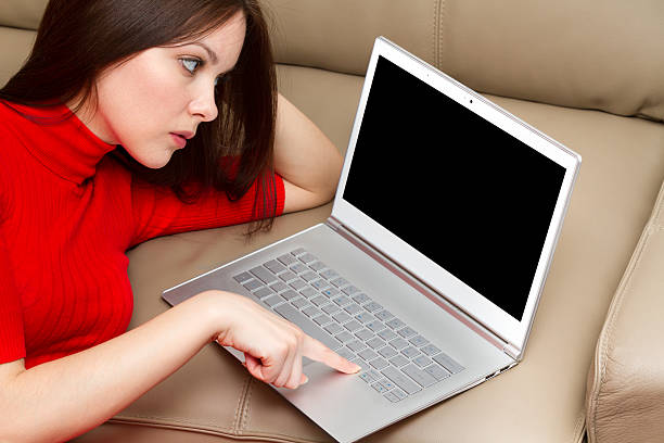 Beautiful woman with ultra thin laptop. stock photo