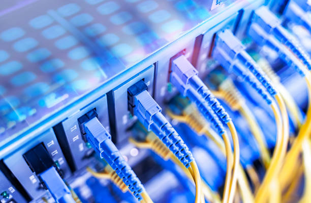 Fiber Optical cables connected to an optic ports and Network cables connected to ethernet ports