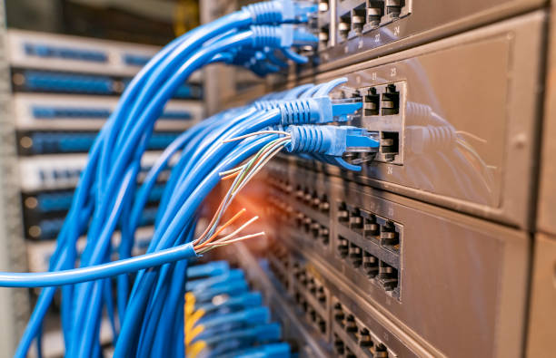 istock damaged stranded network cable is located on the background of the server room. Problem with communication 1780299134