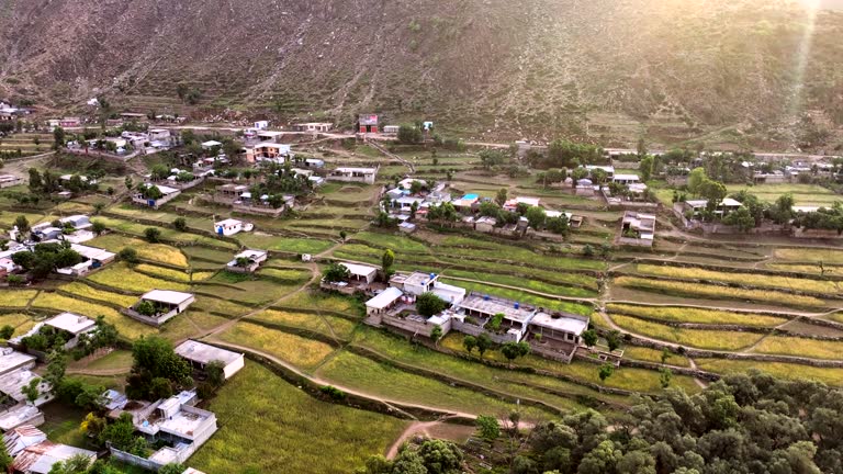 Aerial Drone Sunrise view of Besham city and Rice Field Valley with Indus River in the Shangla District of Khyber Pakhtunkhwa, Pakistan. Located on the right bank of the Indus River in Route of Karakoram Highway